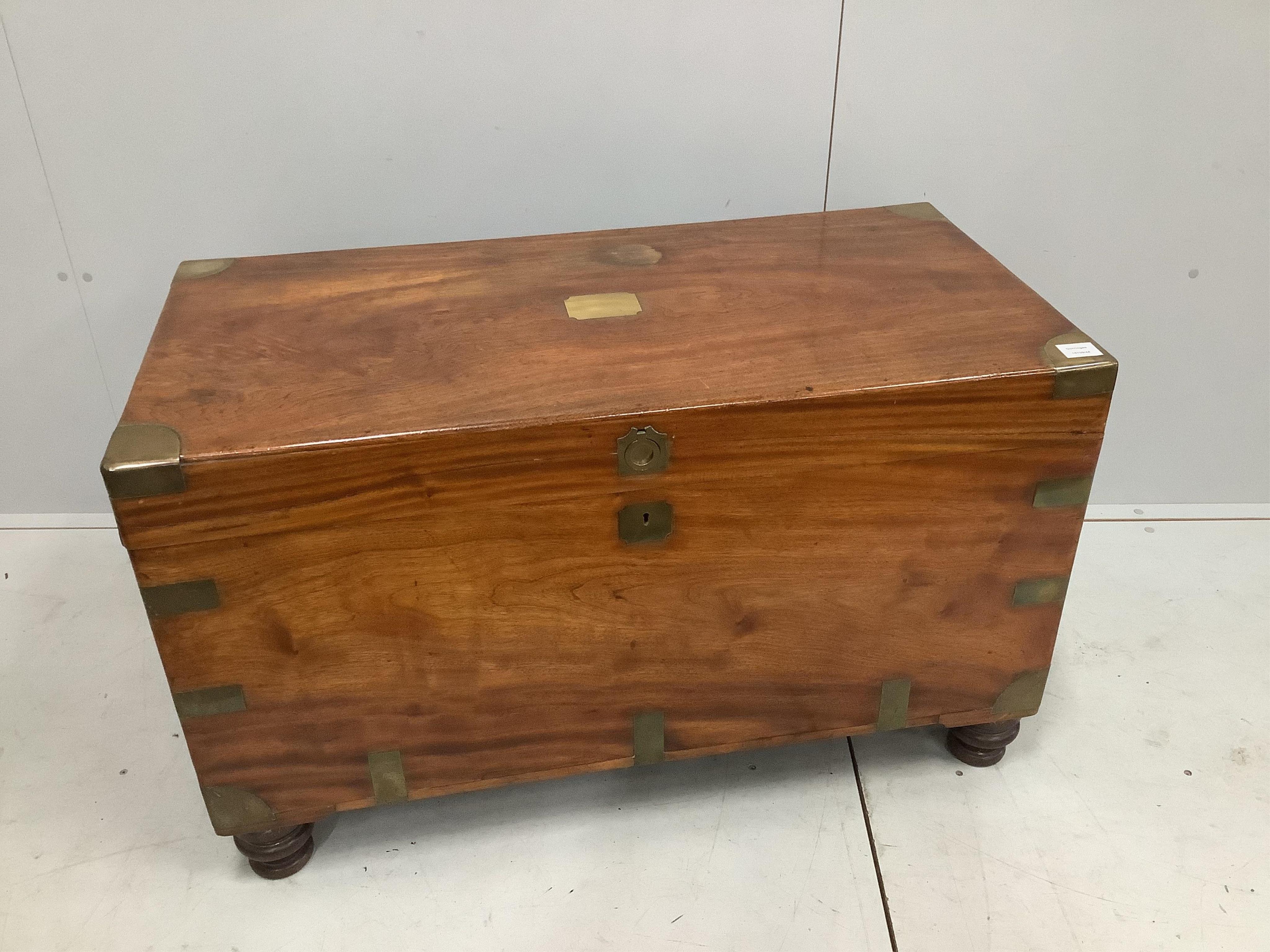 A 19th century camphorwood and brass bound campaign chest, with internal trays, on turned feet, width 106cm, height 64cm. Condition - good